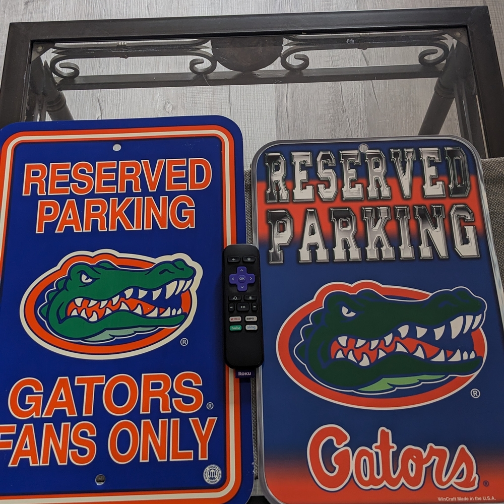 Two Different Gators Reserved Parking Signs